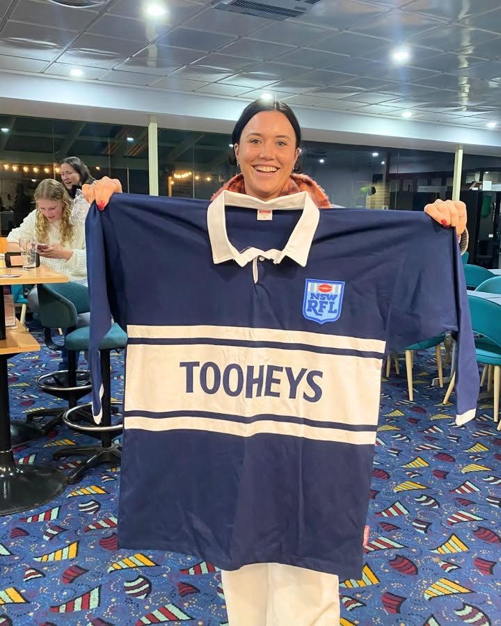 Featured image for “Vintage Tooheys Jersey Scored at Tathra Sea Eagles Event: Zoe Collins Wins Retro Prize at Tathra Beach Bowling Club”